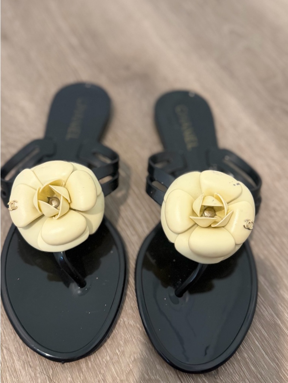 CHANEL Black Jelly Thong Sandals with Cream Camellia Accent